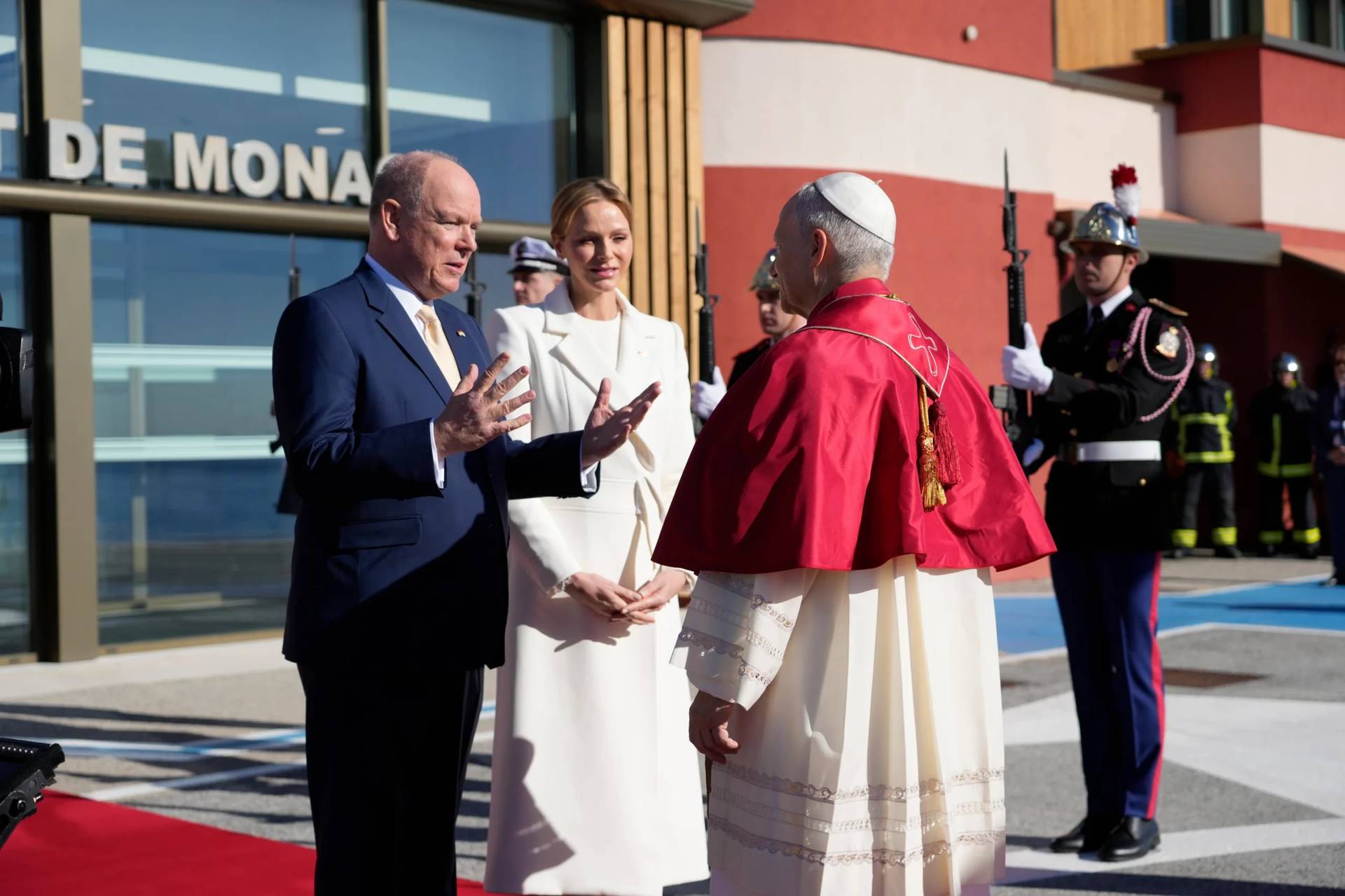 Prince Albert II of Monaco and Princess Charlene of Monaco welcome Pope Leo XIV on the tarmac of Monaco Heliport in Monte Carlo, Monaco, Saturday, March 28, 2026. (Credit: Gregorio Borgia/Pool via AP.)