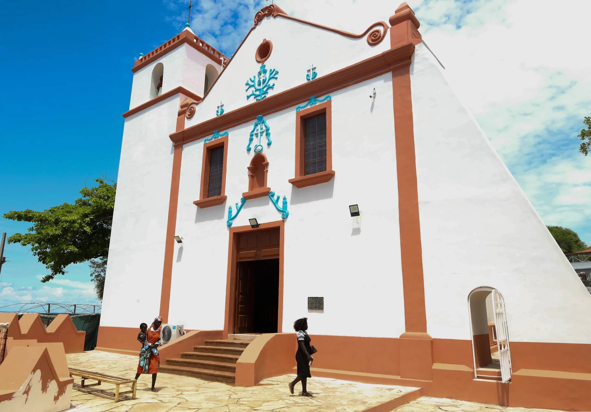 People walk by the Church of Our Lady of Muxima in Muxima, Angola, Saturday, April 11, 2026, which Pope Leo XIV will visit during his 11-day pastoral visit to Africa. (Credit: AP Photo.)