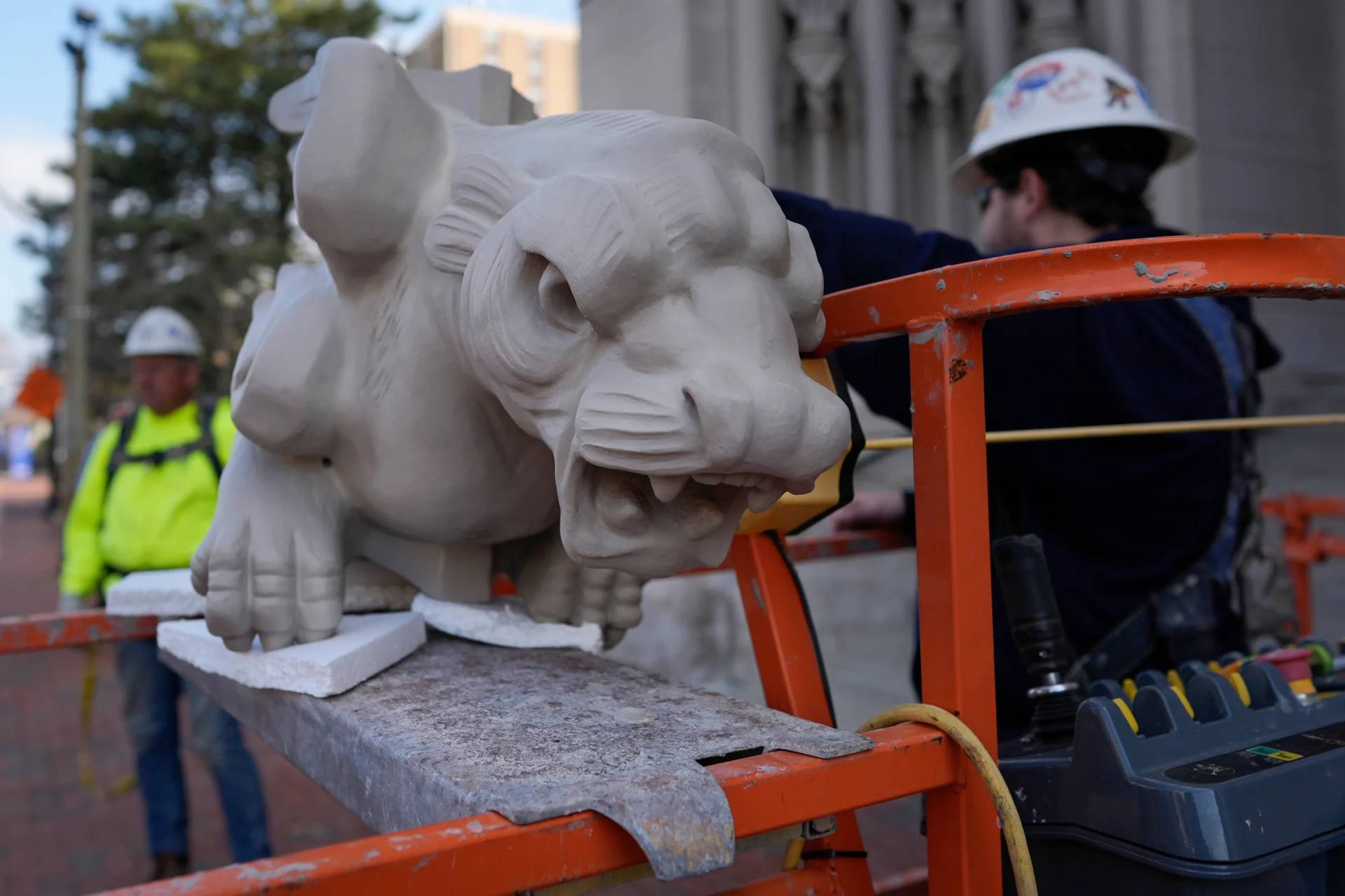 The final new terra cotta gargoyle is prepared for installation high on the Cathedral Basilica of the Assumption, known as "America's Notre Dame," in Covington, Ky., on Monday, March 30, 2026. (Credit: Carolyn Kaster/AP.)