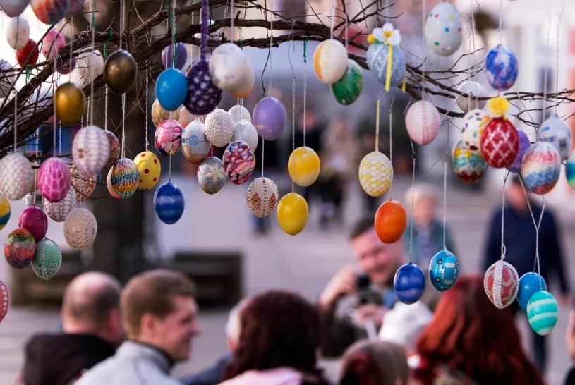 Painted Easter eggs hang from an Easter Tree in Saalfeld, central Germany, March 30, 2018. (Credit: Jens Meyer/AP.)
