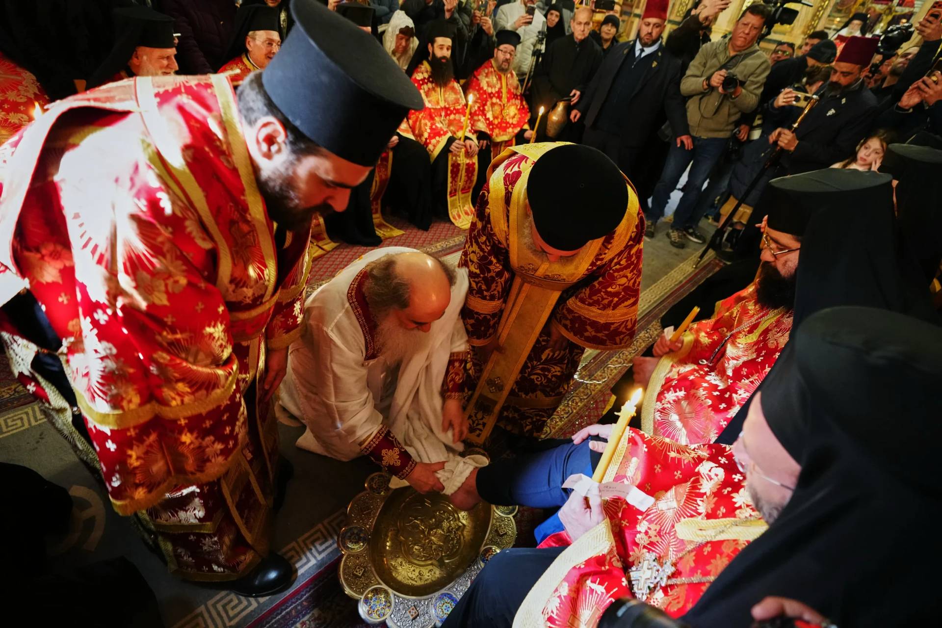 Patriarch Theophilos III, the Greek Orthodox Patriarch of Jerusalem, center left, performs the Washing of the Feet ceremony, at the Church of the Holy Sepulcher, after restrictions were lifted following a ceasefire reached between Iran, Israel and the United States, in Jerusalem's Old City, Thursday, April 9, 2026. (Credit: Mahmoud Illean/AP.)