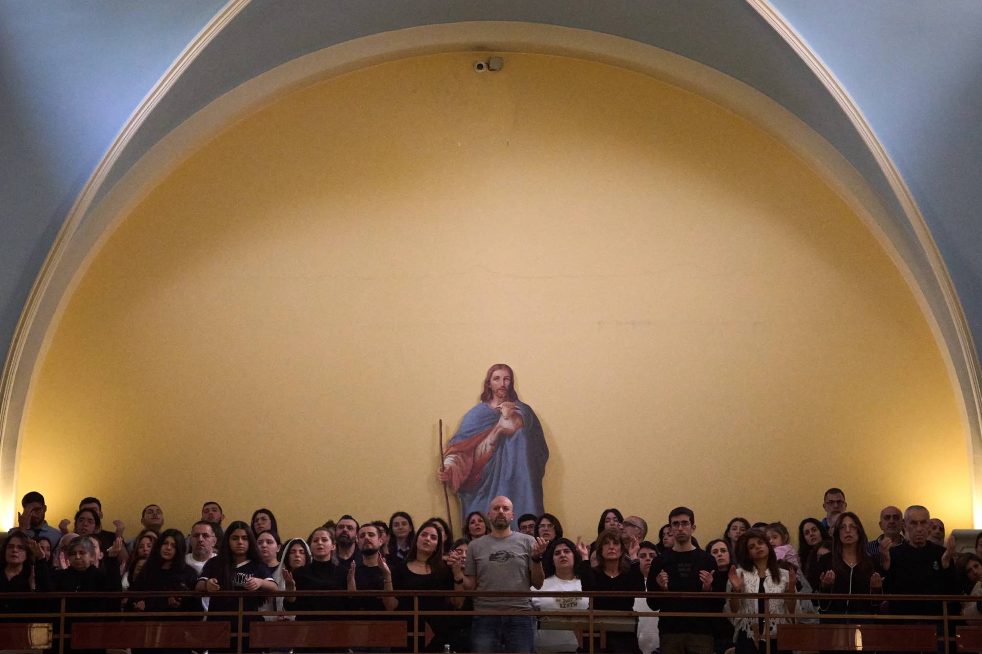 Worshipers pray during Good Friday Mass at St. Anthony Church, which was devoted to expressing solidarity with Christian villagers in southern Lebanon displaced by the war in Jdeideh, a suburb of Beirut, Lebanon, Friday, April 3, 2026. (Credit: Emilio Morenatti/AP.)