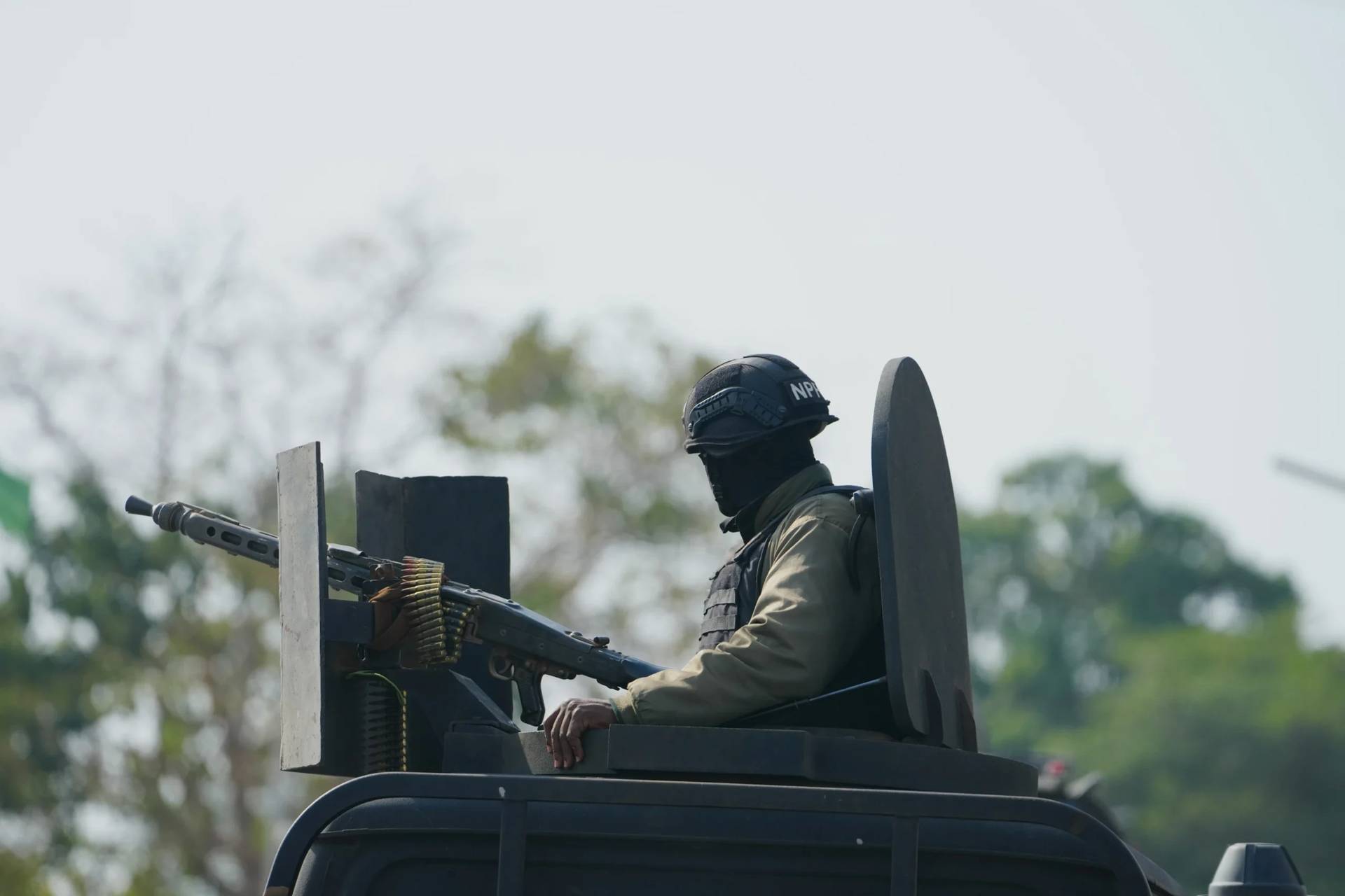 A Nigerian police officer stands guard during an event in Minna, Nigeria, on Dec. 22, 2025. (Credit: Sunday Alamba/AP.)