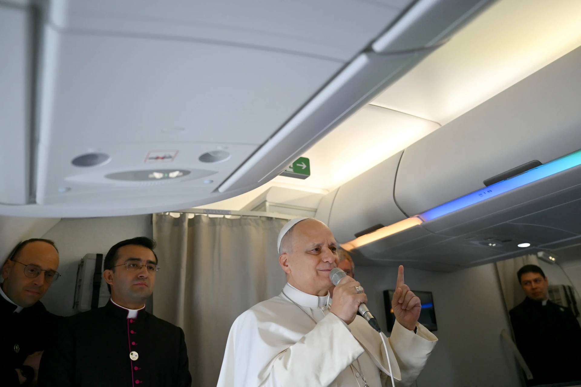Pope Leo XIV speaks to journalists aboard his flight bound for Algiers’ Houari Boumédiène International Airport on Monday, April 13, 2026, at the start of an 11-day apostolic journey to Africa. (Credit: Alberto Pizzoli/Pool Photo via AP.)