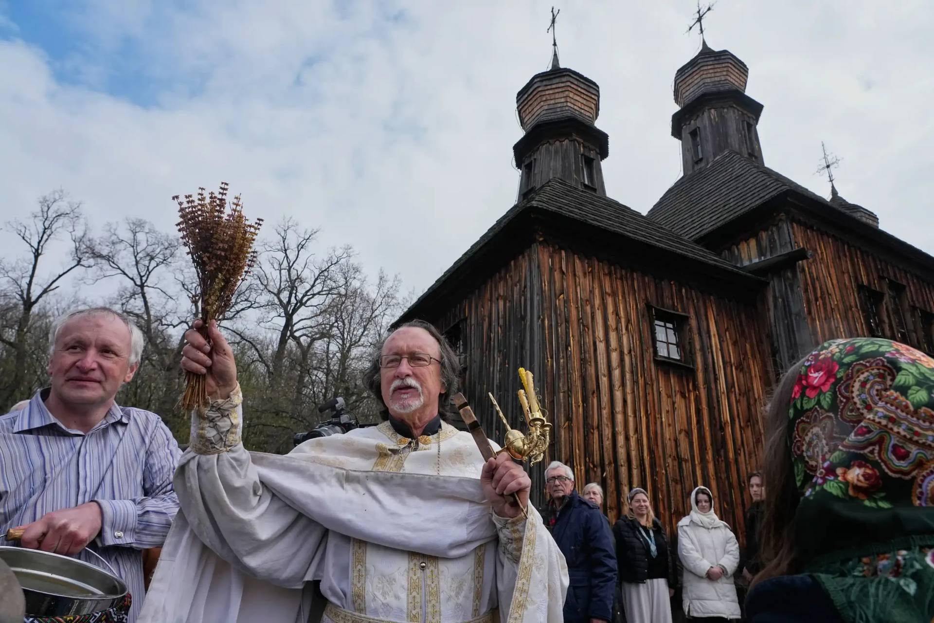 Priests bless believers and their Easter baskets to mark Orthodox Easter, in Pyrohiv, close to Kyiv, Ukraine, Sunday, April 12, 2026. (Credit: Efrem Lukatsky/AP.)