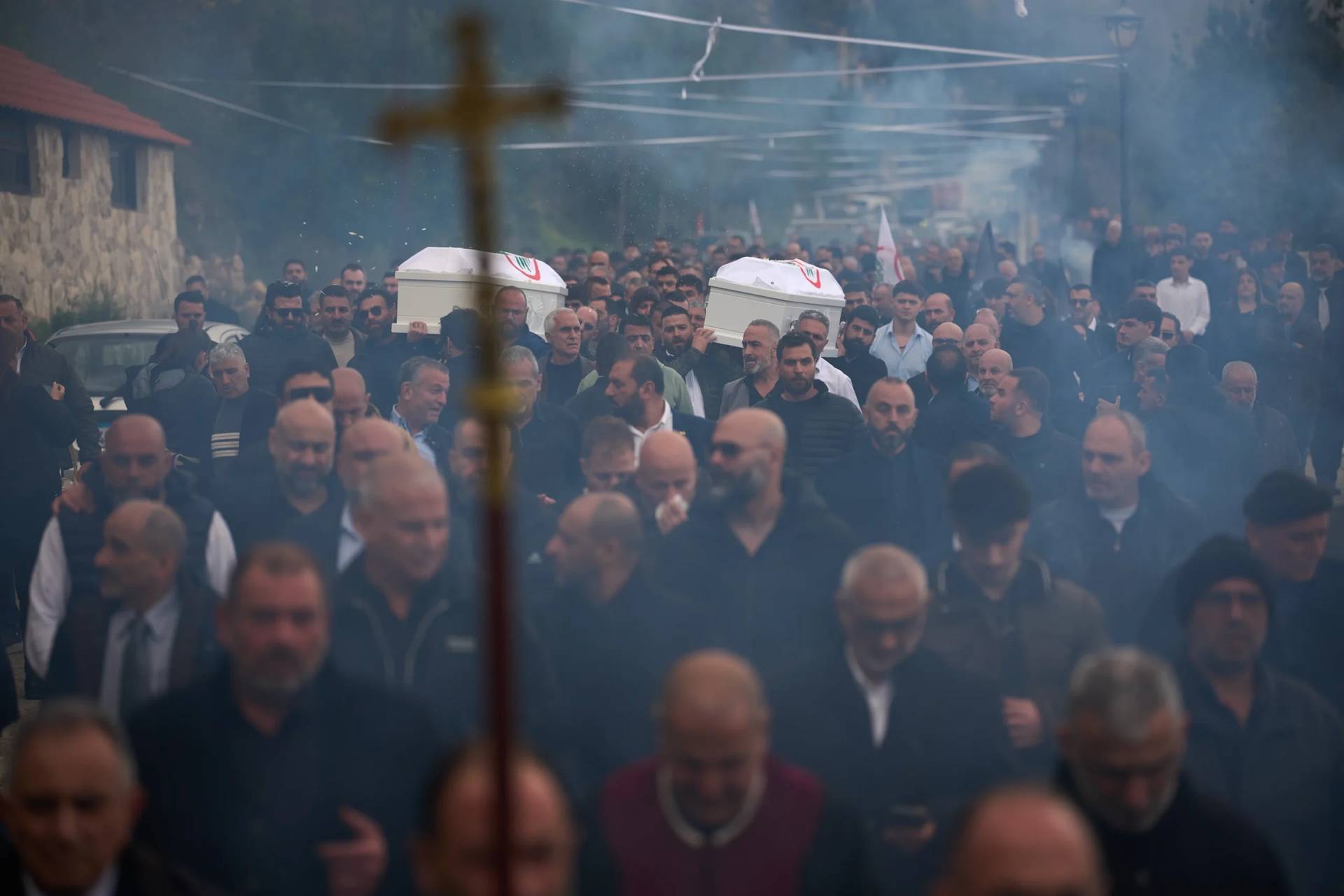 Men carry the coffins with the bodies of Pierre Mouawad, an official with the anti-Hezbollah Lebanese Forces party, and his wife during their funeral in Yahshush, in Lebanon, Tuesday, April 7, 2026. (Credit: Emilio Morenatti/AP.)