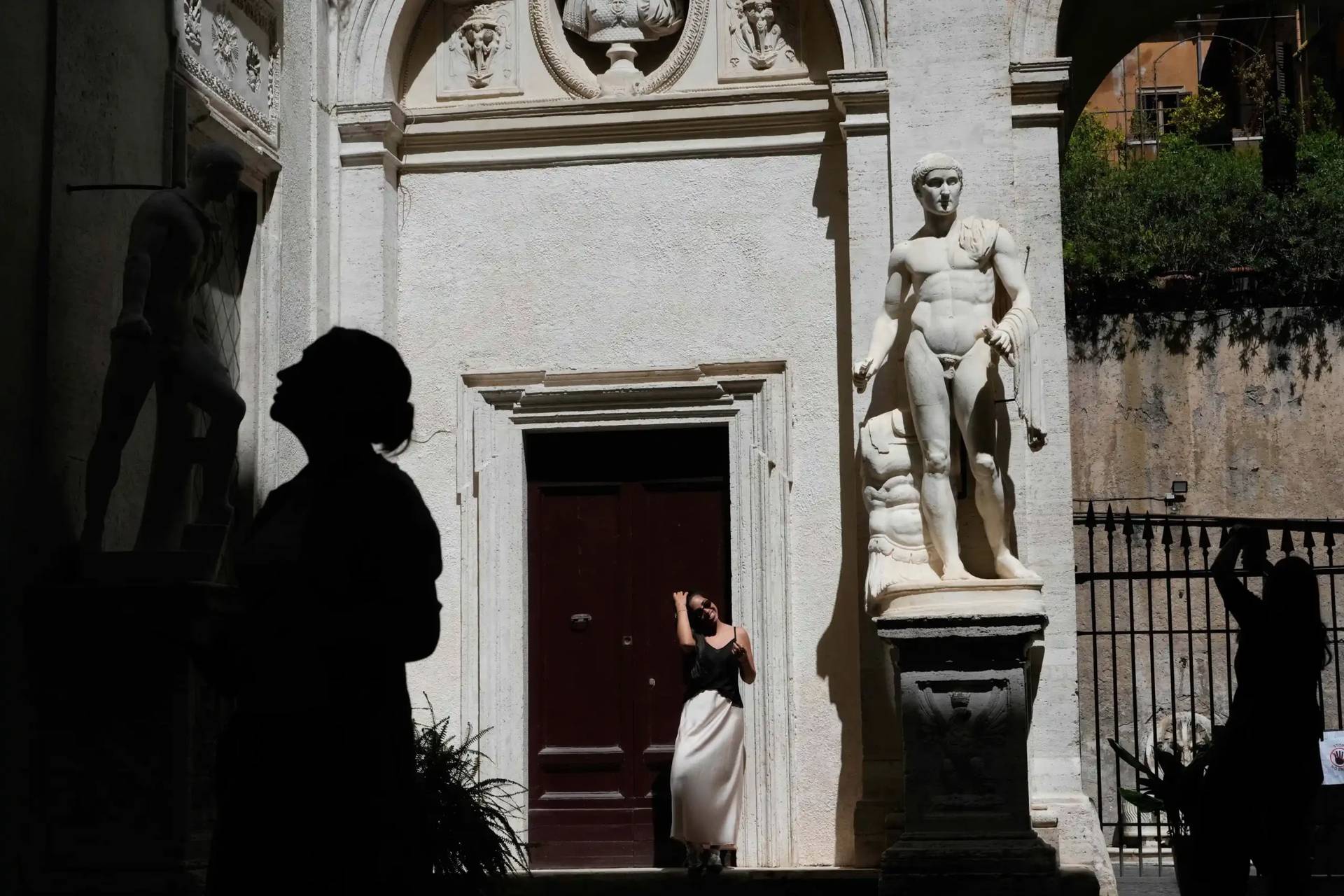 Tourists visit the American Studies center courtyard adorned with Ancient Roman statues, in Rome, Thursday, April 16, 2026. (Credit: Gregorio Borgia/AP.)