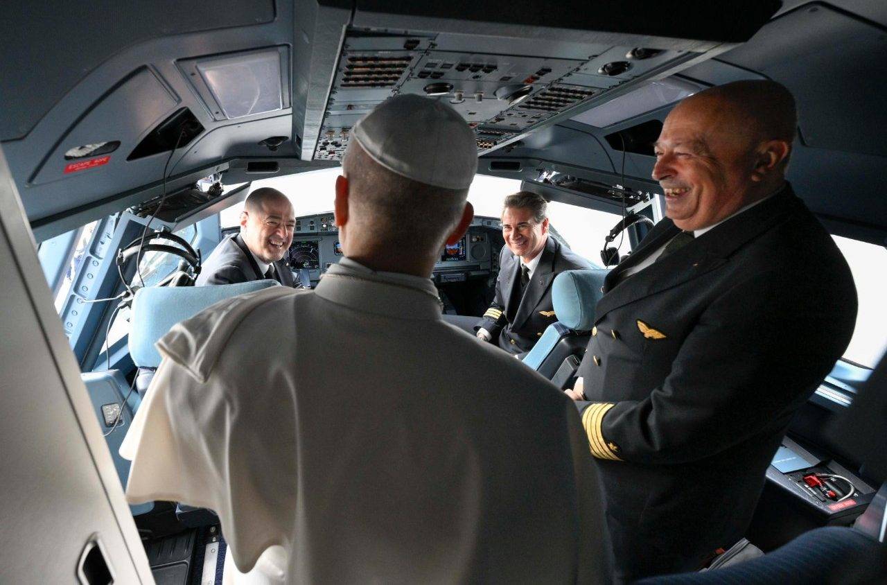 Pope Leo XIV greets flight crew on the papal plane headed to Algeria, April 13, 2026. (Credit: Vatican Media.)