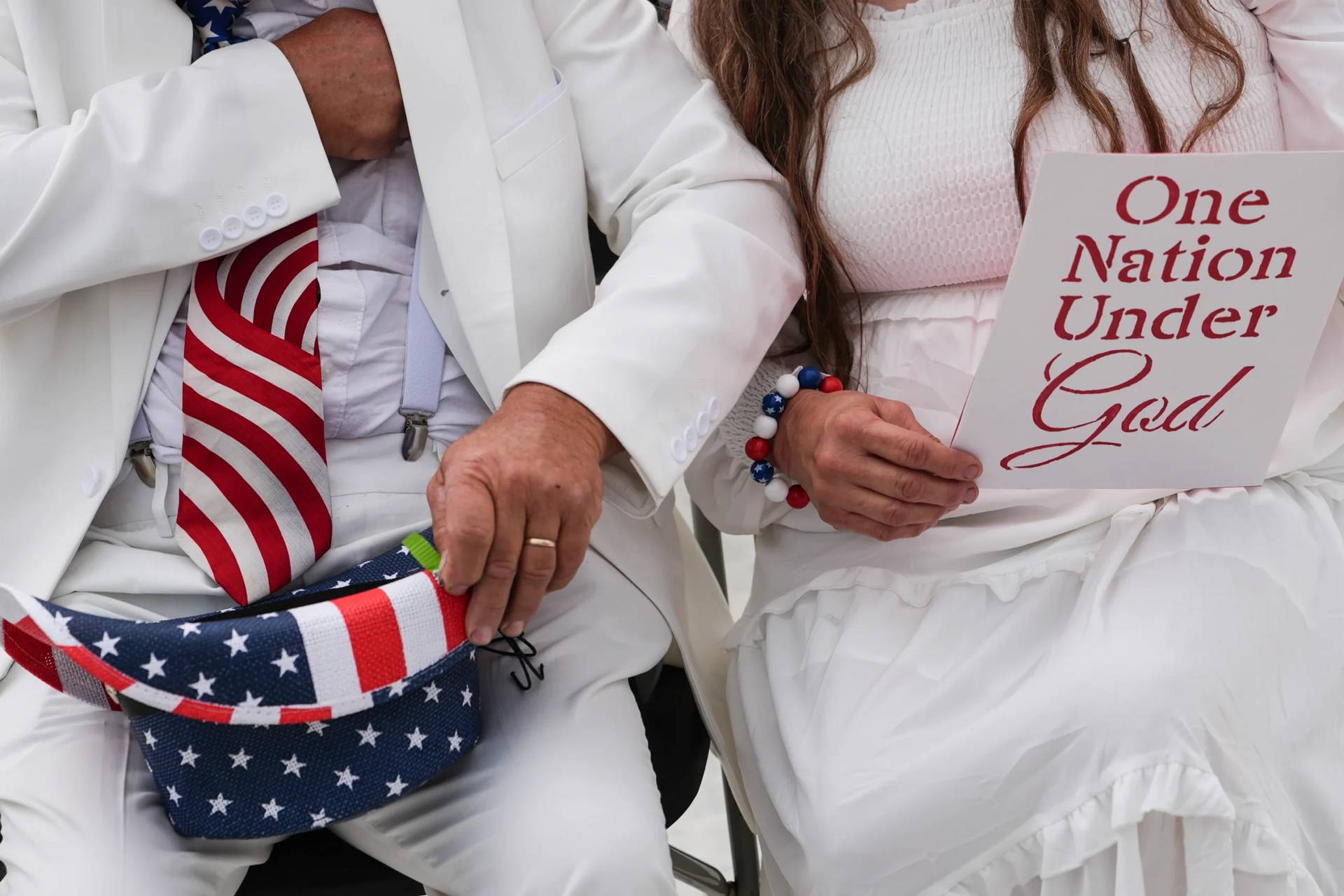 Dorothea and Billy Ohlandt, from North Carolina, arrive at Rededicate 250, a mostly conservative Christian prayer gathering in honor of the United States' 250th anniversary, on the National Mall, Sunday, May 17, 2026, in Washington. (Credit: Julia Demaree Nikhinson/AP.)