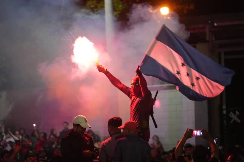 Supporters of the party LIBRE, Liberty and Refoundation, protest the general election results in Tegucigalpa, Honduras, Tuesday, Dec. 9, 2025. (Credit: Moises Castillo/AP.)