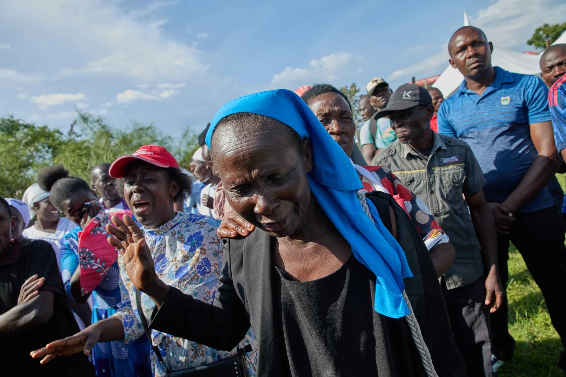 Professional mourners grieve alongside family members and friends of the deceased during a funeral on the outskirts of Kisumu, Kenya, Friday, March 13, 2026. (Credit: Asa Wallin/AP.)