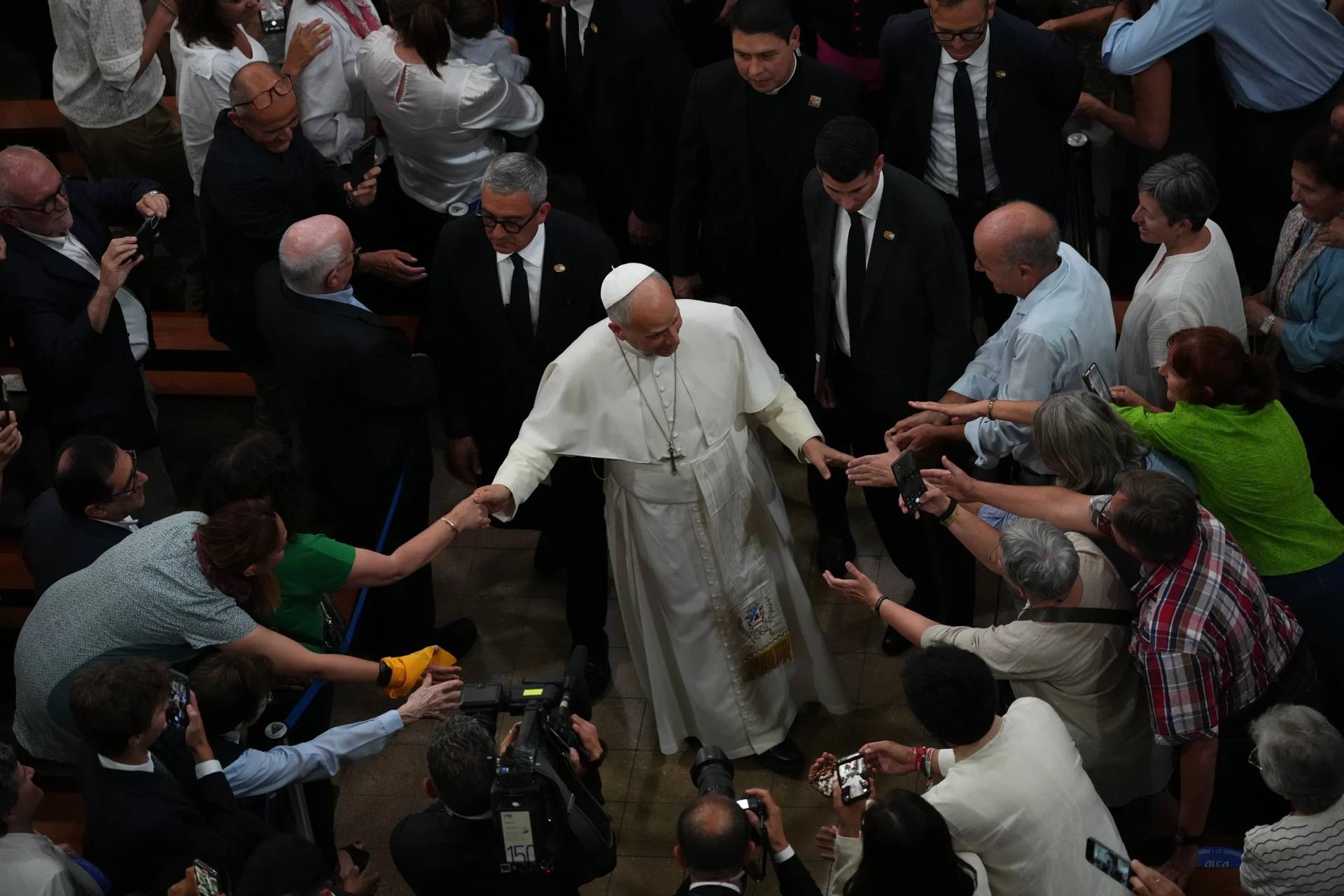 Pope Leo XIV leaves at the end of a meeting with faithful and members of the diocesan charity and welfare organizations in the Church of Sant Agusti in Barcelona, Spain, Wednesday, June 10, 2026 (Credit: Alessandra Tarantino/AP.)