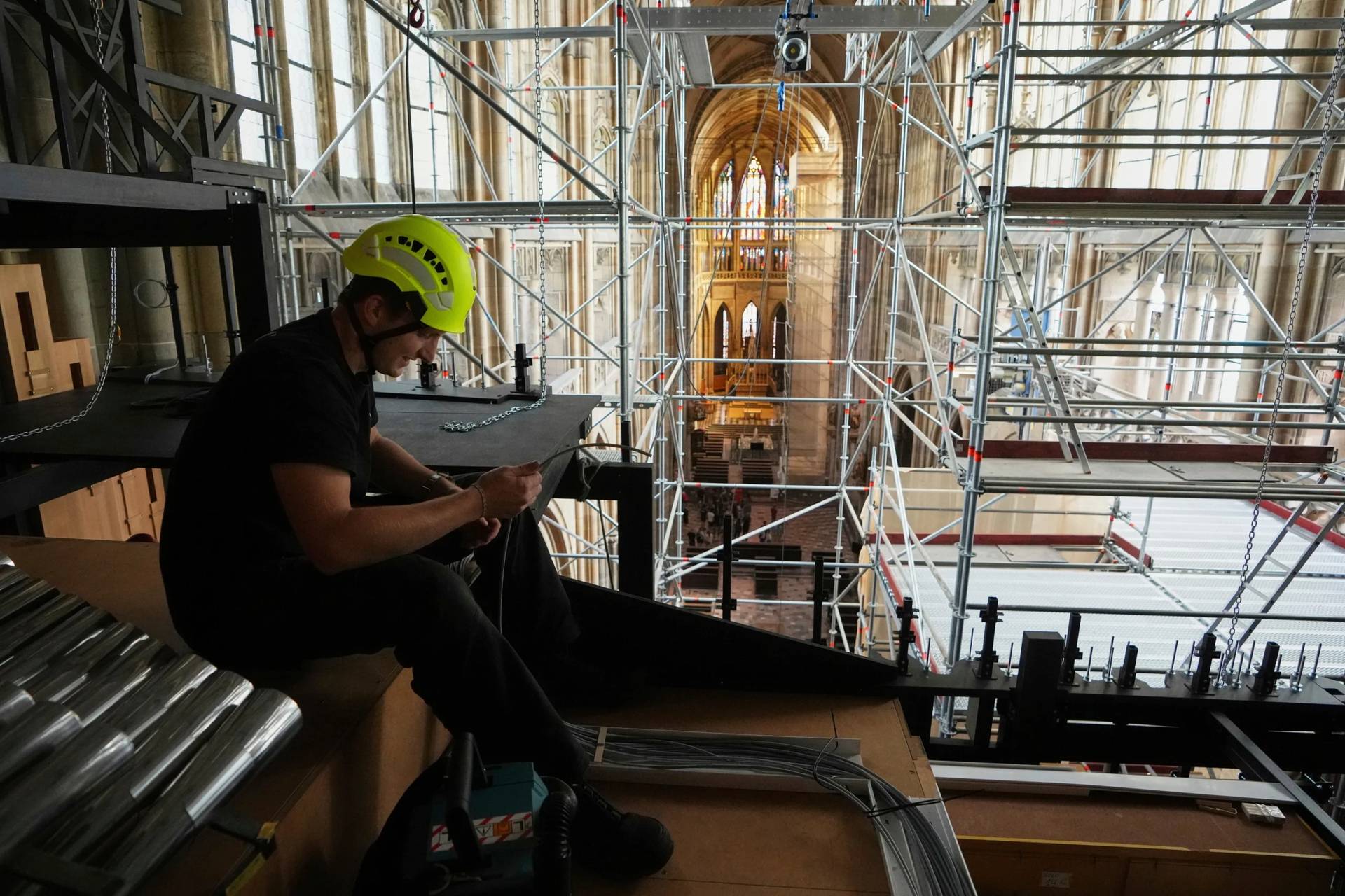 A worker adjusts cables during the installation of a new organ at Prague’s St. Vitus Cathedral that is coming to its final stages in Prague, Czech Republic, Tuesday, July 22, 2025. (Credit: Petr David Josek/AP.)