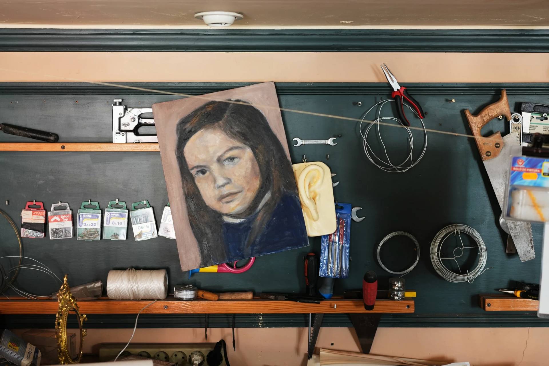 A childhood self-portrait by Paula Alonso hangs in the studio of her apartment in Madrid, Spain, Thursday, May 21, 2026. (Credit: Bernat Armangue/AP.)