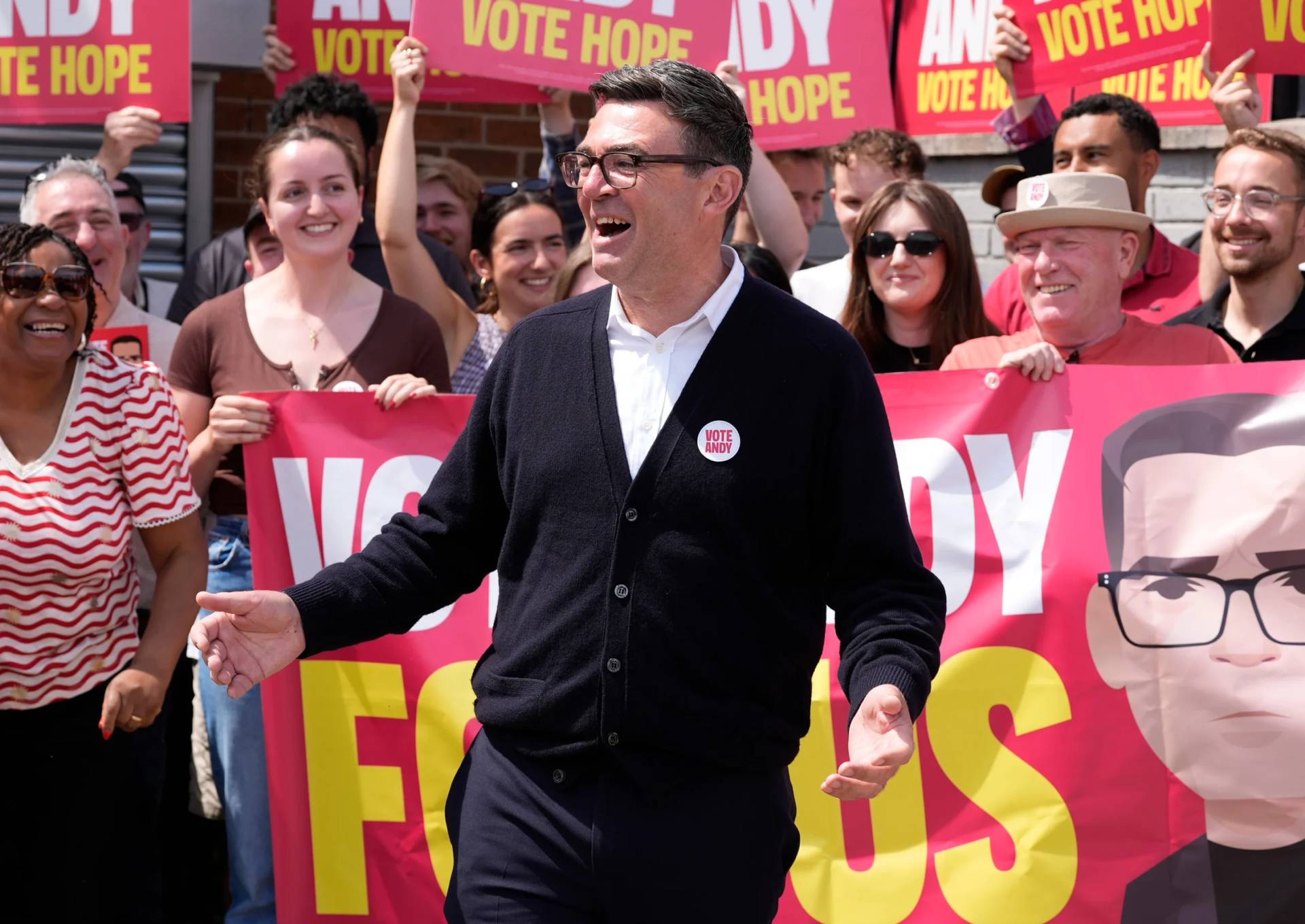 Andy Burnham gestures, surrounded by supporters at the Stubshaw Cross Community and Sports Club as voting is underway in the Makerfield by-election, in Ashton-in-Makerfield, England, June 18, 2026. (Credit: Peter Byrne/PA via AP.)
