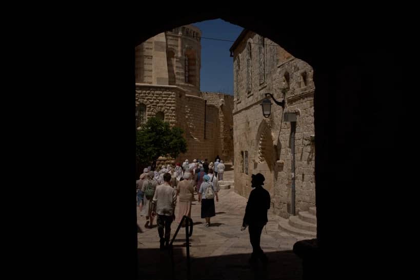Christian pilgrims walk past the site where a nun was attacked by a man last Wednesday, after visiting the Cenacle, traditionally believed to be the site of the Last Supper, in Jerusalem, Friday, May 1, 2026. (Credit: Leo Correa/AP.)