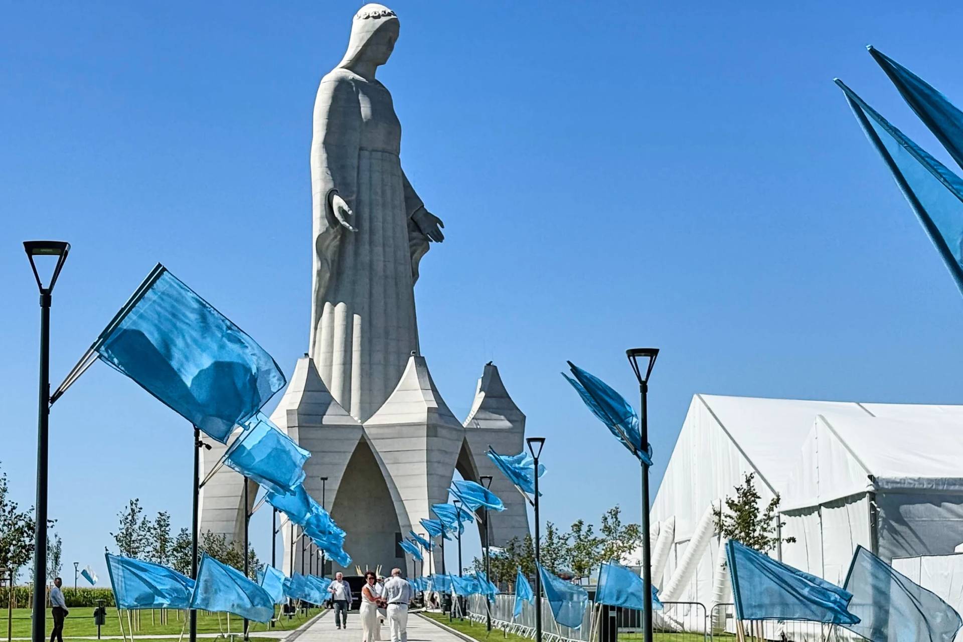 People walk inside an enormous statue of the Virgin Mary that is believed to be Europe's tallest during the inauguration in the village Konotopie, Poland, Saturday, Aug. 15, 2026. (Credit: Claudia Ciobanu/AP.)