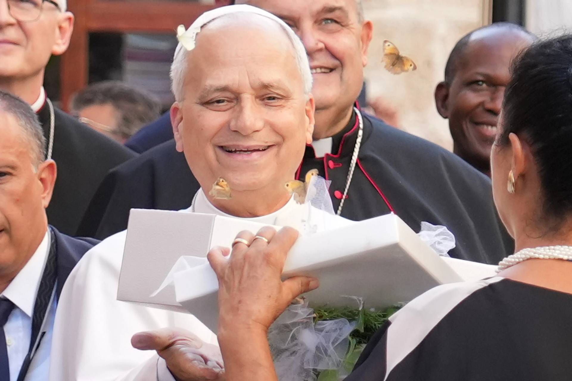Pope Leo XIV receives a box with butterflies as he arrives at the Basilica Sanctuary of the Mother of Good Counsel in Genazzano, central Italy, Monday, Sept. 7, 2026. (Credit: Andrew Medichini/AP.)