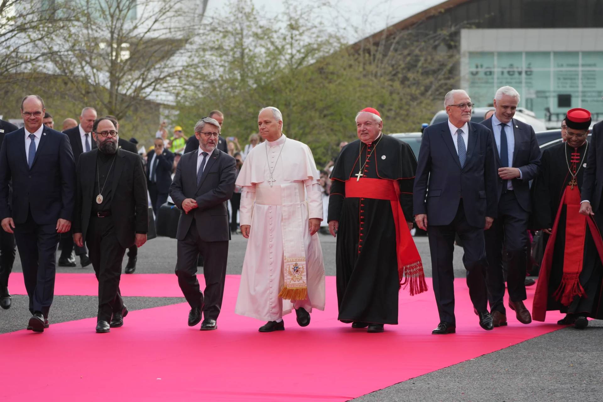 Pope Leo XIV, center, arrives, with, from left, Christian Krieger, president of the Protestant Federation of France, Bishop Dimitrios (Ploumis), the Greek Orthodox Metropolitan of France, Haïm Korsia, Chief Rabbi of France, President of the French Bishops' Conference, Cardinal Jean-Marc Aveline, Chems-eddine Hafiz, rector of the Grand Mosque of Paris, Anthony Boussemart, representing French Buddhists, and Cardinal George Jacob Koovakad, prefect of the Dicastery for Interreligious Dialogue, to attend an interreligious meeting at the Robert Schuman Convention Centre, Monday, Sept. 28, 2026, in Metz, France. (Credit: Gregorio Borgia/AP.)