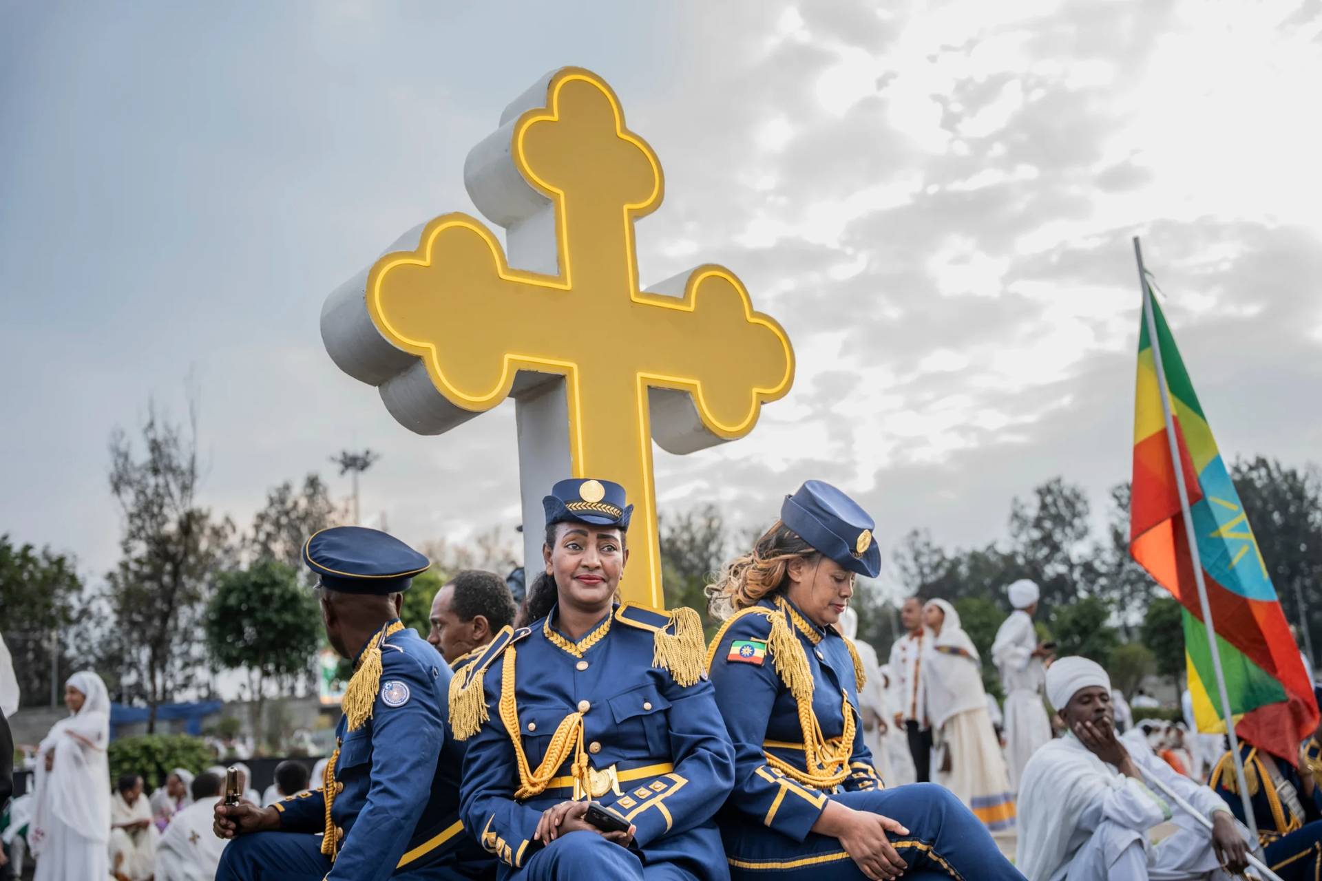 Members of Ethiopian Federal police march band look on during celebrations for the Orthodox holiday of Meskel, an annual holiday celebrating the discovery of the True Cross in the fourth century by the Roman Empress Helena, in Addis Ababa, Ethiopia, Saturday, Sept. 26, 2026. (Credit: Amanuel Sileshi/AP.)