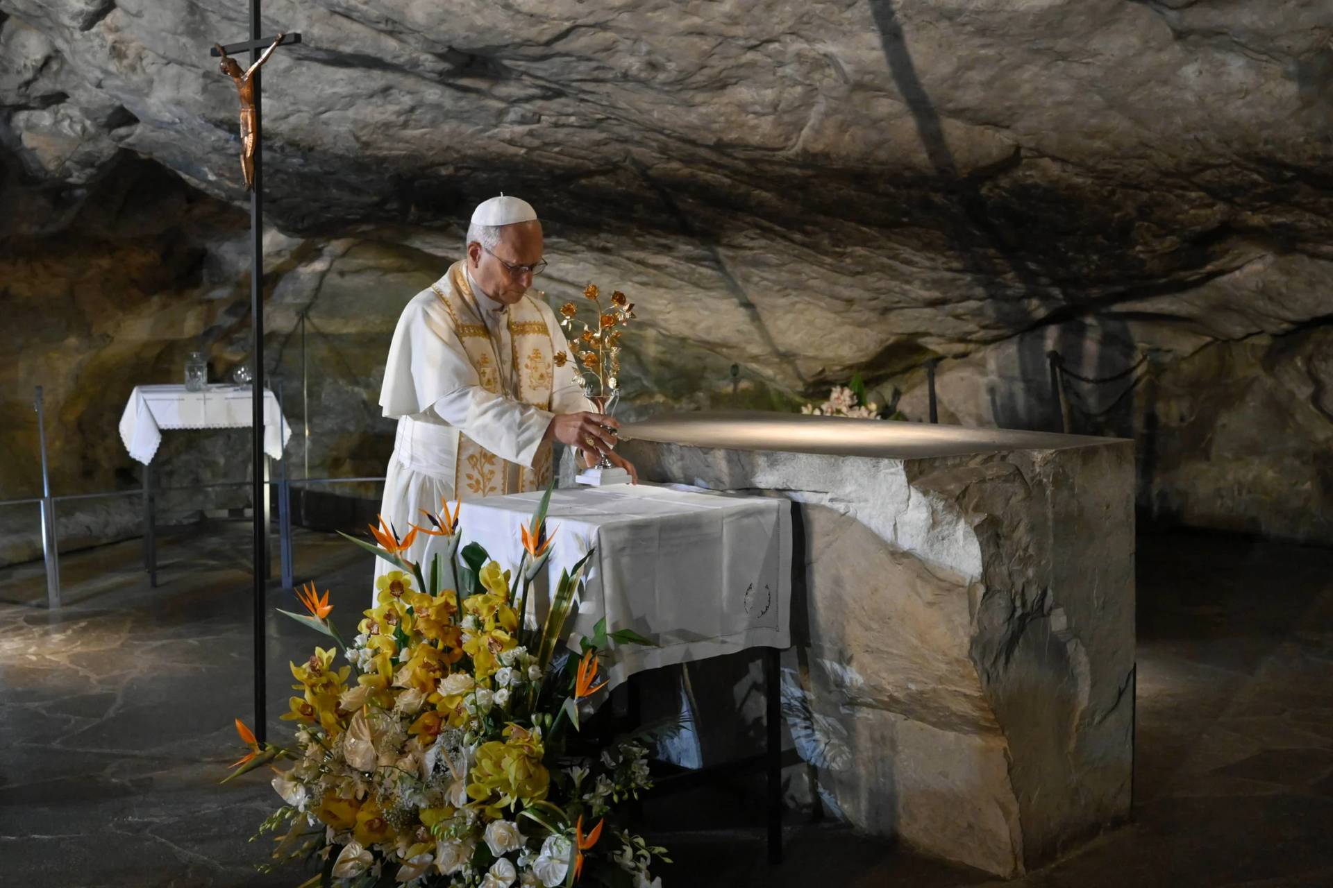 In this handout photo provided by Vatican Media Pope Leo XIV prays at the Grotto of the Apparitions of Massabielle, in Lourdes, France, Saturday, Sept. 26, 2026. (Credit: Vatican Media via AP.)