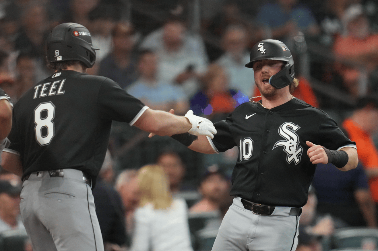 Chicago White Sox's Chase Meidroth (10) celebrates with Kyle Teel (8) after scoring off a 2-run single hit by by Sam Antonacci during the second inning in Game 1 of baseball's American League Wild Card Series against the Houston Astros, Tuesday, Sept. 29, 2026, in Houston. (Credit: Karen Warren/AP.)