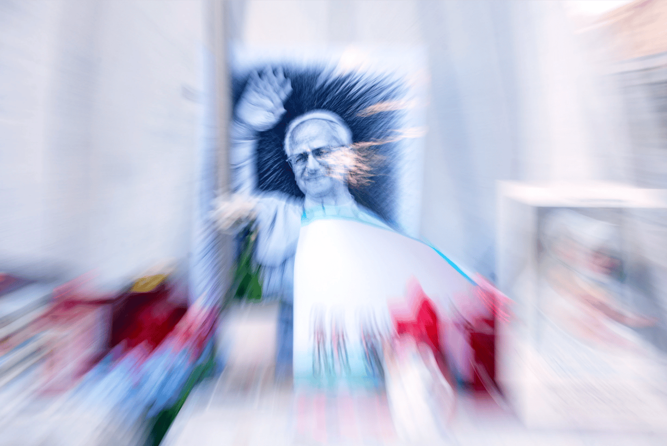 An image of Pope Leo XIV is seen under the statue of late Pope St. John Paul II at the Agostino Gemelli Polyclinic where the pontiff is hospitalised, in Rome, Friday, Oct. 16, 2026. (Credit: Gregorio Borgia/AP.)