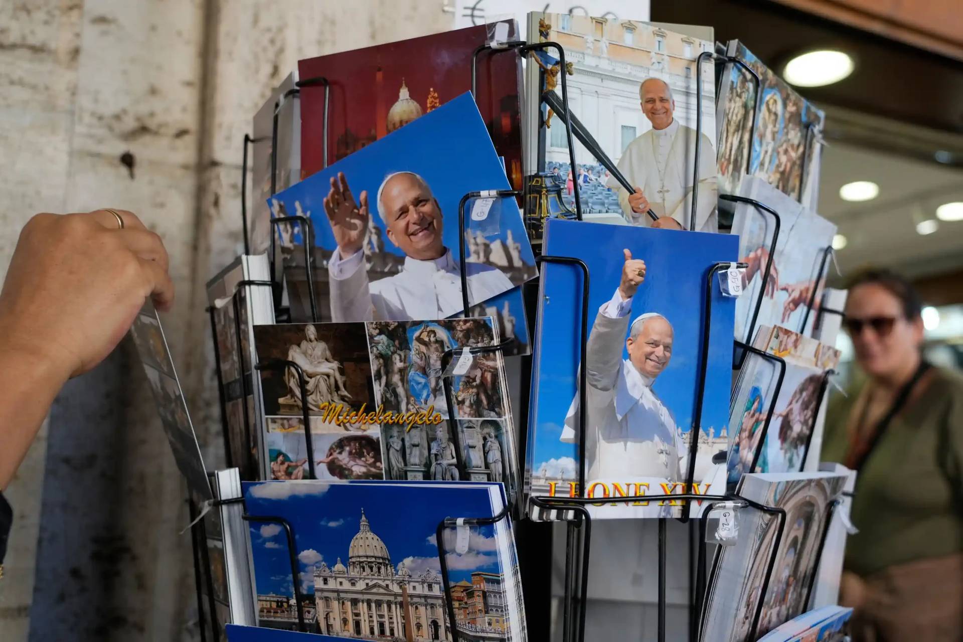 Postcards of Pope Leo XIV are displayed outside a shop selling religious items near St. Peter's Square, in Rome, Monday, Oct. 12, 2026. (Credit: Gregorio Borgia/AP.)