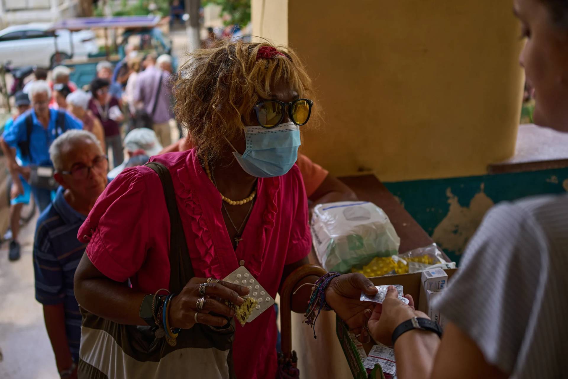 A woman receives medicine distributed through the “Medicine Is Not for Sale” community project in Havana, Cuba, Thursday, Oct. 8, 2026. (Credit: Ramon Espinosa/AP.)