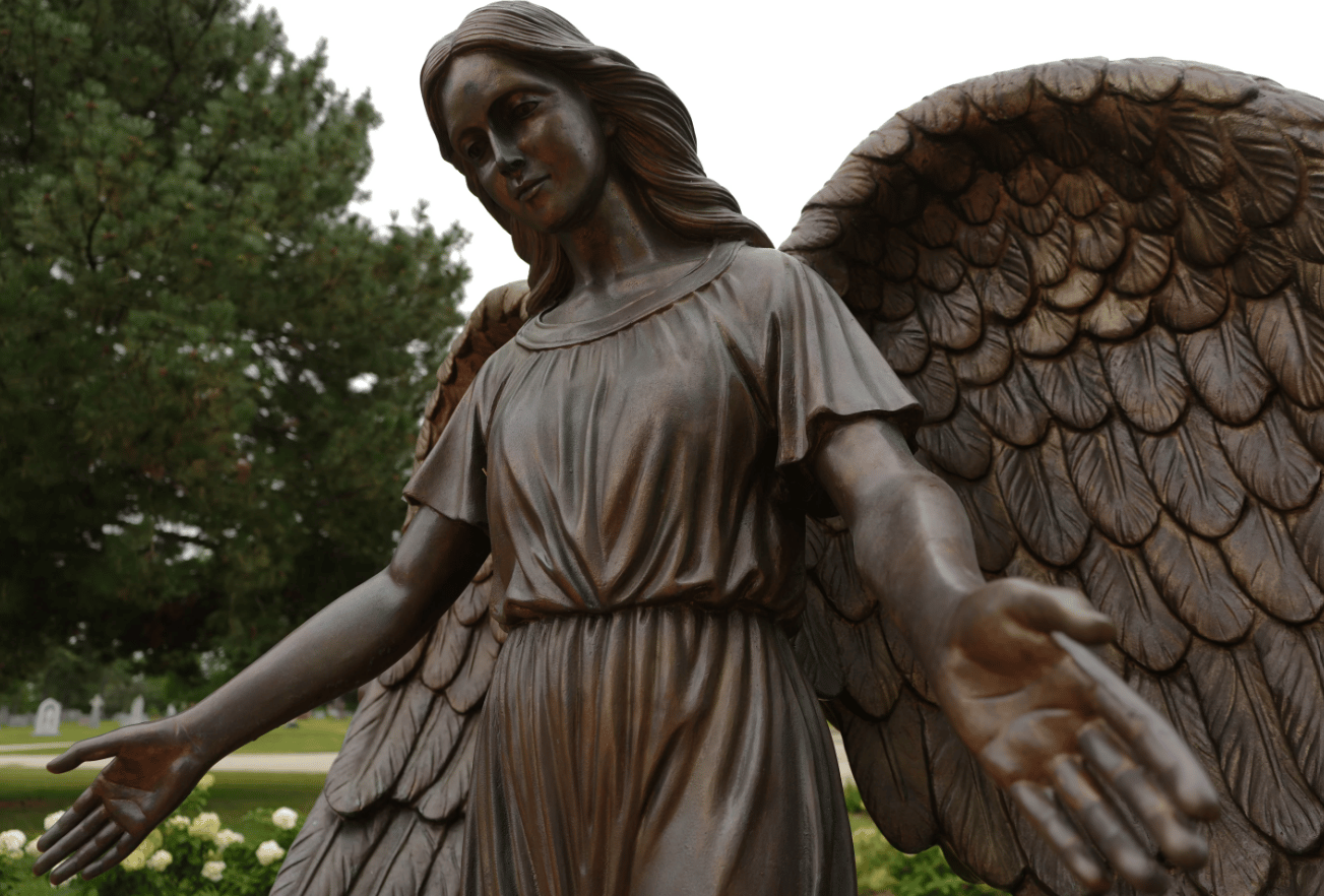 A sculpture of an angel stands at a memorial for survivors and lives lost to suicide dedicated by the Archdiocese of Chicago at Queen of Heaven Catholic Cemetery in Hillside, Ill., on Wednesday, Sept. 9, 2026. (Credit: Luis Andres Henao/AP.)