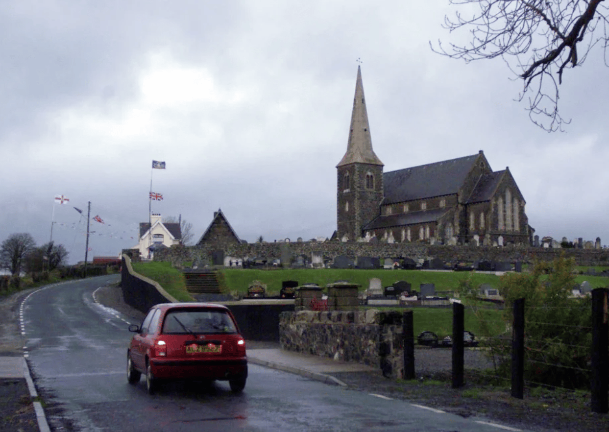 The often barricaded Protestant church of Drumcree stands alone near the town of Portadown, Thursday, Dec. 2, 1999. (Credit: Adam Butler/AP.)
