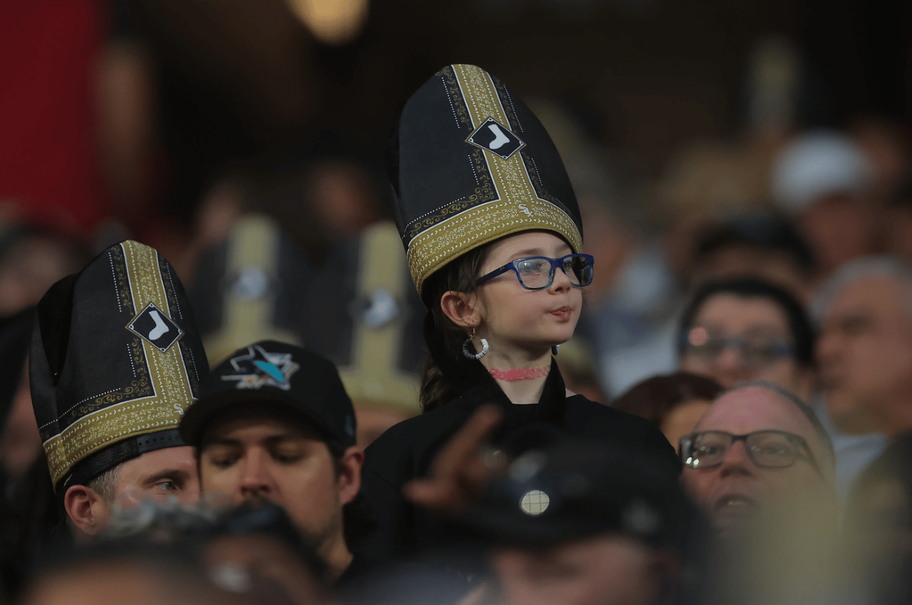 A fan wears a promotional pope hat during a baseball game between the Cincinnati Reds and Chicago White Sox in Chicago on Aug. 11, 2026. (Credit: Melissa Tamez/AP.)