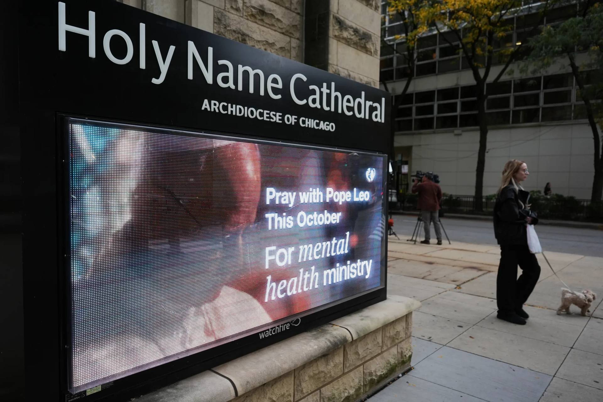 A pedestrian walks past Holy Name Cathedral in Chicago’s calls for prayers, Wednesday, Oct. 14, 2026, for Pope Leo XIV after his lung cancer diagnosis. (Credit: Nam Y. Huh/AP.)