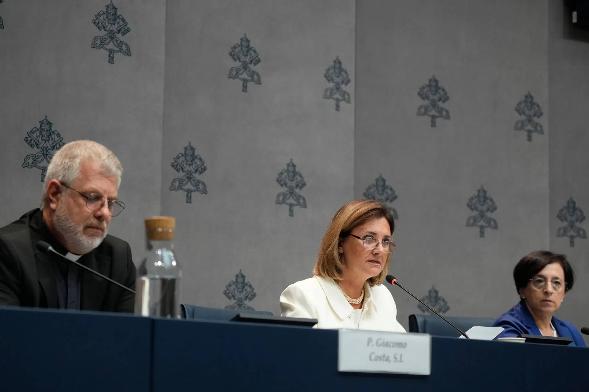Father Giacomo Costa, consultor of the General Secretariat of the Synod, from left, Gabriella Gambino, undersecretary of the Vatican's Dicastery for the Laity, Family and Life, and Orietta Rachele Grazioli, a professor of canon and comparative family law, attend a news conference presenting Pope Leo XIV's meeting with the heads of the Eastern Churches and the presidents of the Episcopal Conferences, at the Vatican, Friday, Oct. 2, 2026. (Credit: Gregorio Borgia/AP.)
