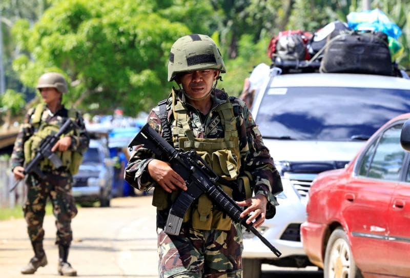 Gunmen take Catholic hostages; Philippines’ Duterte imposes martial law