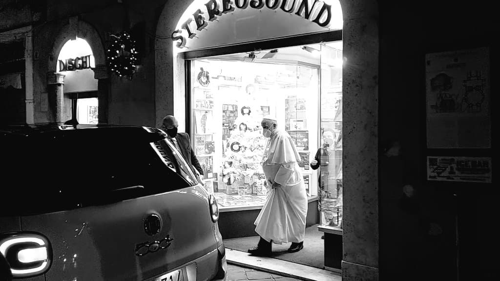 Pope Francis makes an evening visit to a record shop in Rome