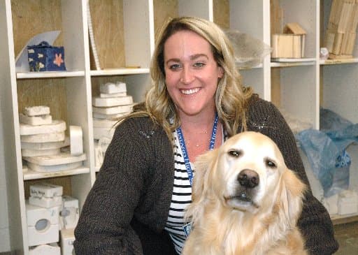 Golden retriever, her owner share joy with students at Catholic schools