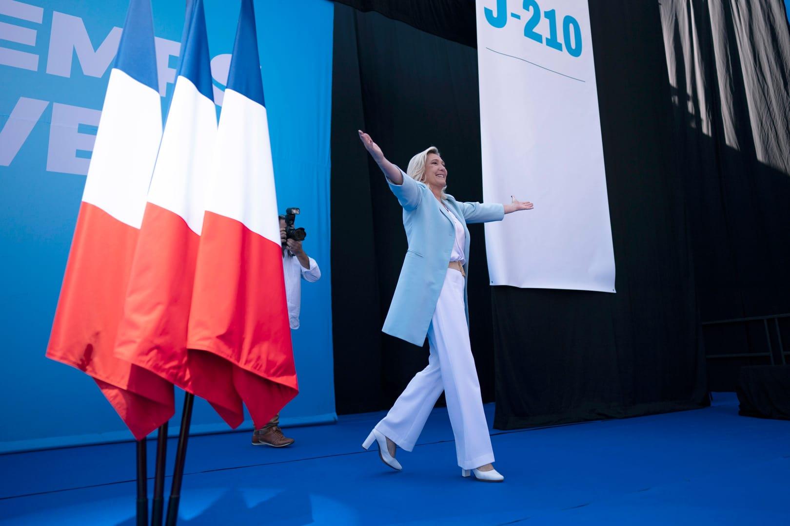 French far-right leader Le Pen softens image for election