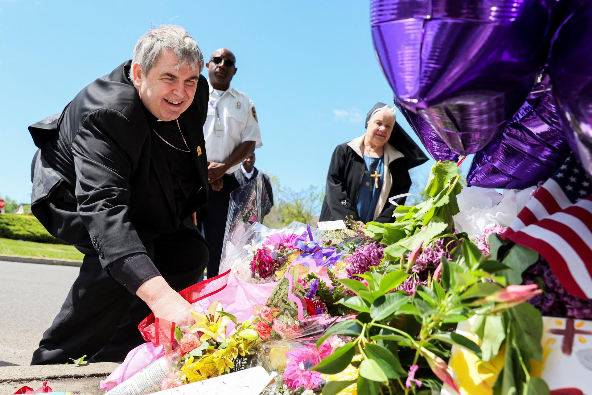 Buffalo bishop lays flowers, personal prayer at mass shooting memorial