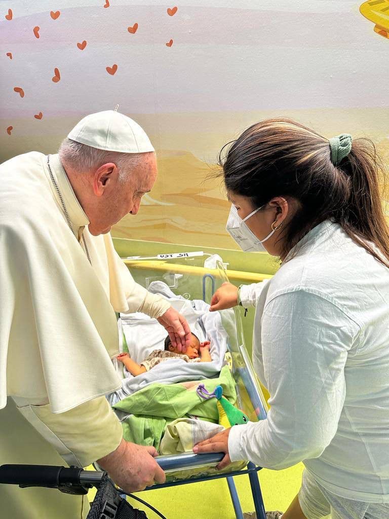 Pope Francis visits sick children, baptizes infant in hospital