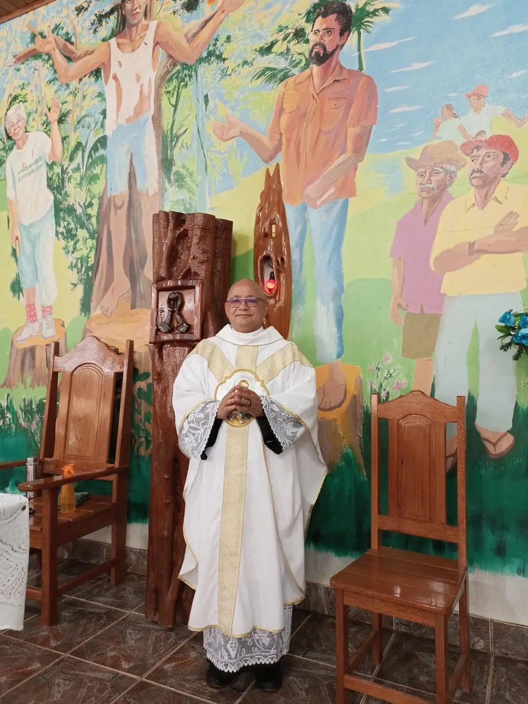 Church mural showing Catholic martyrs of land dispute in Brazil covered