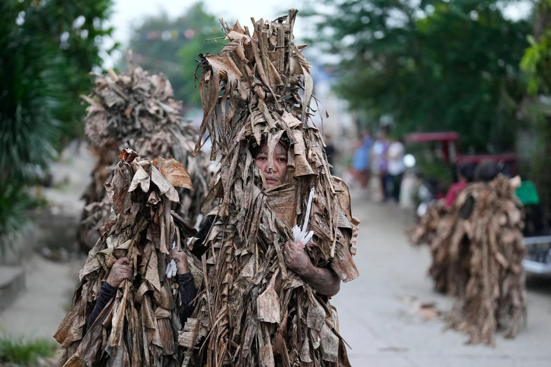 Philippine Catholics honor St. John the Baptist with a mud-covered display of faith